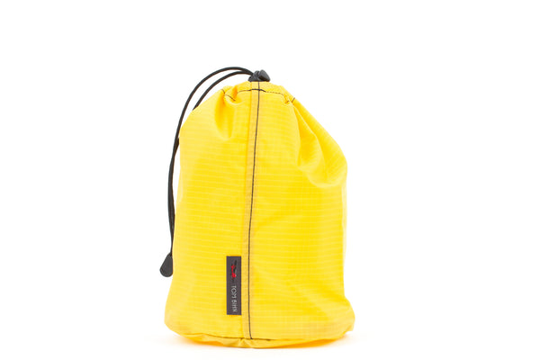 A Size 3 Marigold (yellow with light yellow grid) 210 Cerylon Travel Stuff Sack.